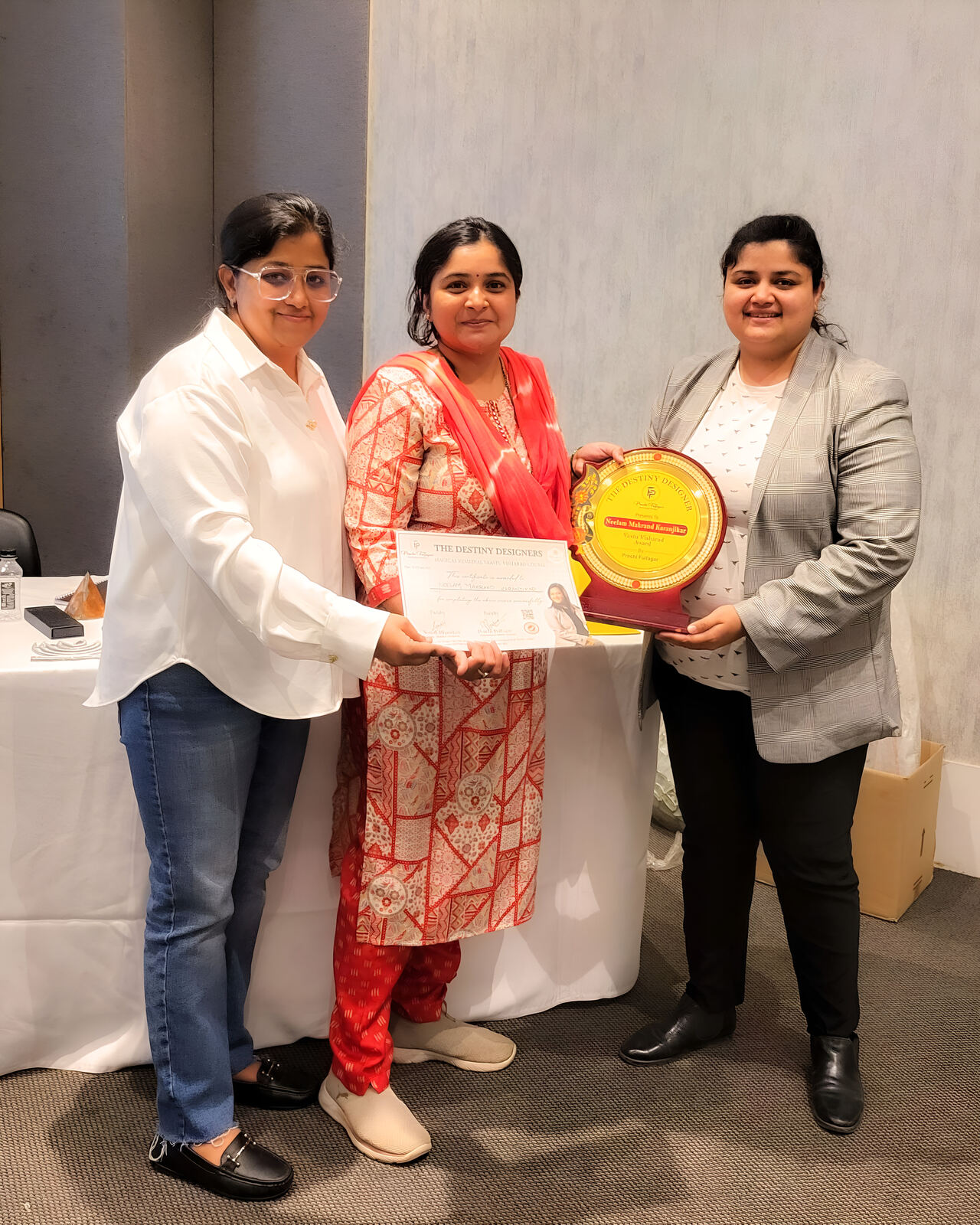 Vastu workshop participants receiving certificates from Prachi Fulfagar